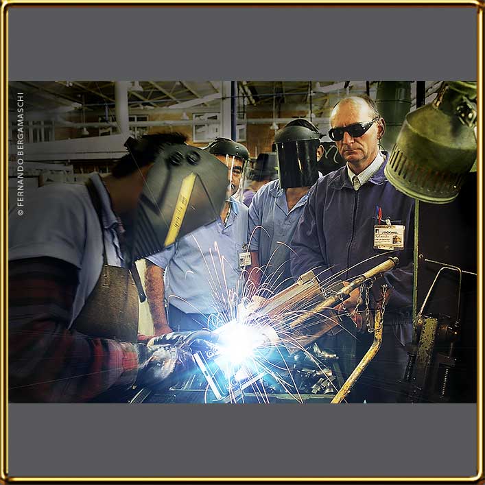 Technician inspecting welding in industry